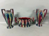 three vases sitting next to each other on a table