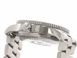 a close up of a watch with a chain around it
