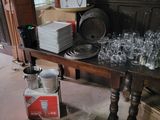 a table with a lot of empty glasses on it