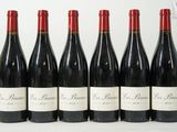 six bouteilles de vin rouge alignées