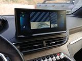 a car dashboard with a monitor and keyboard in it