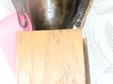 a small statue of a buddha sitting on a table