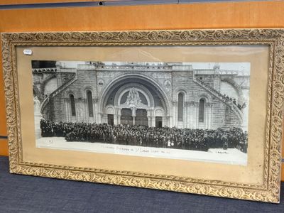 an old picture of a group of people standing in front of a building