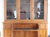 an image of a wooden desk with a glass door