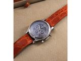 a close up of a watch in a box on a table