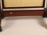 a small wooden table with a mirror on top of it