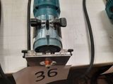 two electric tools on a table with a price tag