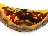 a glass bowl with a design on it on a white surface