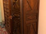 a large wooden cabinet in the corner of a room