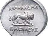 a close up of a silver coin with a lion on it