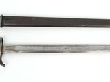 an old knife and a small knife on a white surface