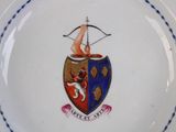 an image of a plate with a coat of arms on it