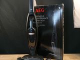 a vacuum that is sitting on a table next to a box
