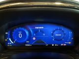 the dashboard of a car with a digital display on it