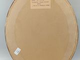 an image of a plate with a label on it sitting on a table