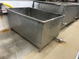 two stainless steel tanks sitting on the floor in the kitchen