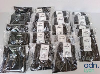 many bags of chocolate sitting on a table