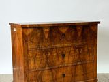 a wooden chest of drawers with two drawers on each side