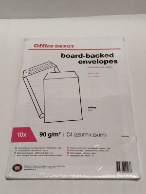 an office depot board - backed envelopes are on a white table