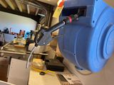 a blue machine that is sitting on a table