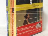 four books that are stacked on top of each other