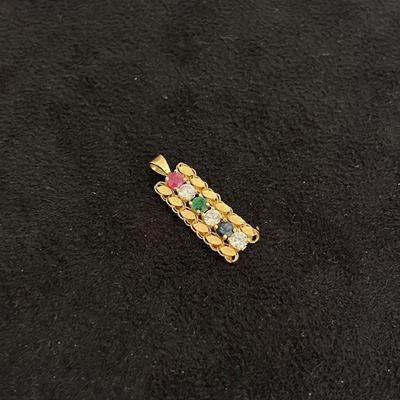 a close up of a piece of jewelry on a black surface