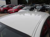 a lot of cars parked in a lot next to each other