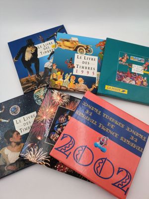 four children ' s books are lined up on a white surface