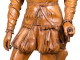 a wooden statue of a man with a sword