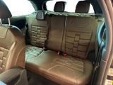 the back seats of a car are brown with black trims