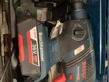 a blue box with tools in it on a table