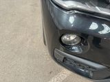 a close up of a car ' s headlight and front bumper