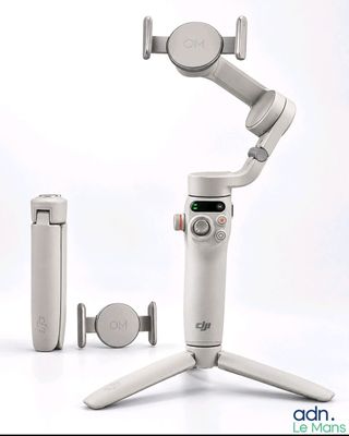 a white device that is sitting on top of a tripod