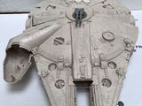 a model of a star wars millennium war vehicle on a table