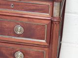 a wooden dresser with a mirror on top of it