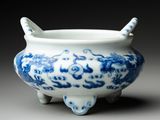 an image of a blue and white bowl with a handle