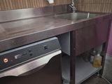 a kitchen with a sink and a dishwasher in it