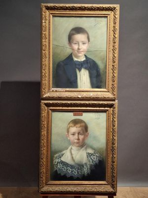 two paintings of a boy and a girl are on display in a museum