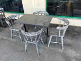 a table and chairs outside of a restaurant that is empty