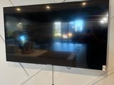 a flat screen tv mounted on a wall in a living room