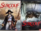 two books on a table with a picture of a pirate and a ship in the background