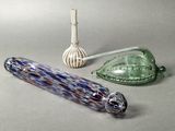three glass objects on the table next to each other