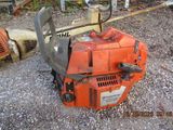 an image of a chainsaw sitting on the ground