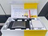 a box with a remote control and other items in it