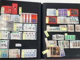 a black book with stamps and post it notes on it