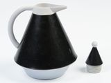 a black and white pitcher next to a small white cone