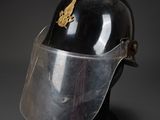 a close up of a helmet with a clear vise on a black background