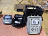 a cell phone, a bag, and a cell phone sitting on a table