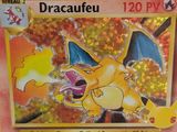 a pokemon card with a picture of a dragon on it