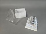 a silver ring in a clear box and a silver ring in a white box